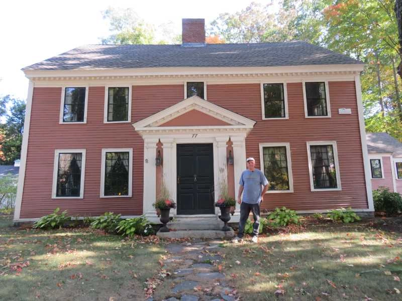 remodeled home image with Ed in front